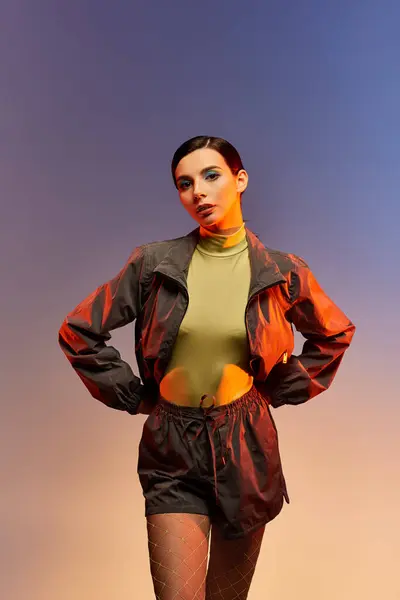 Fashionable young woman poses confidently in stylish attire with a captivating backdrop. — Stock Photo