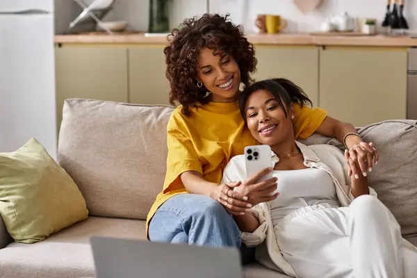 Loving couple enjoys a relaxed day on the couch, sharing smiles and laughter while connecting. — Stock Photo