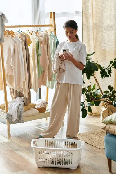 A young African American woman is tidily executing her house cleaning routines in a chic apartment. — Stock Photo