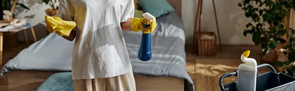 A young African American woman tidies up her cozy, well-decorated apartment while cleaning, banner — Stock Photo