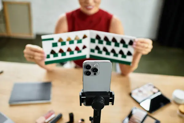 Passionate millennial woman connects with her audience while presenting beauty items online. — Stock Photo