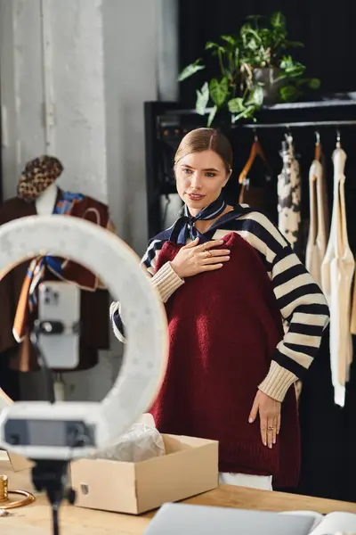 Young woman showcases an eye-catching outfit while filming content in her studio. — Stock Photo