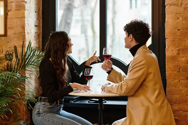A couple enjoys their time together in a cozy restaurant, celebrating love on Valentines Day. — Stock Photo