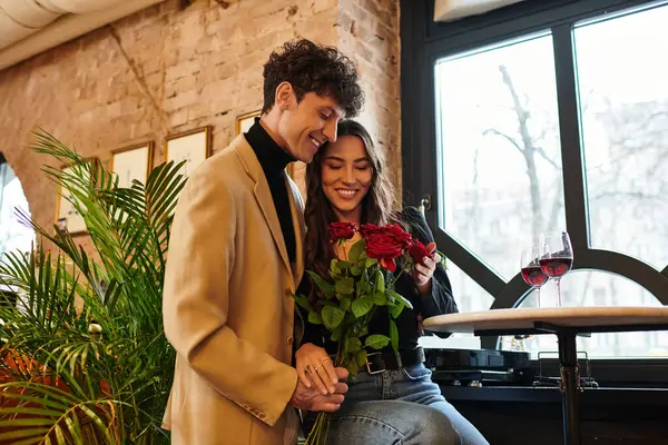 A young couple shares an intimate moment on Valentines Day, surrounded by romance and joy. — Stock Photo