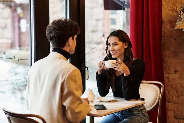 A happy couple enjoys each other's company while celebrating Valentines Day in a romantic setting. — Stock Photo