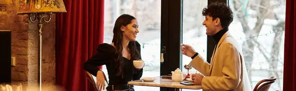 A young couple shares smiles and a warm drink on a romantic Valentines Day date, banner — Stock Photo