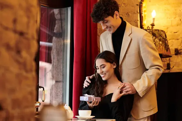 Young couple enjoys a romantic moment together while celebrating love and connection. — Stock Photo