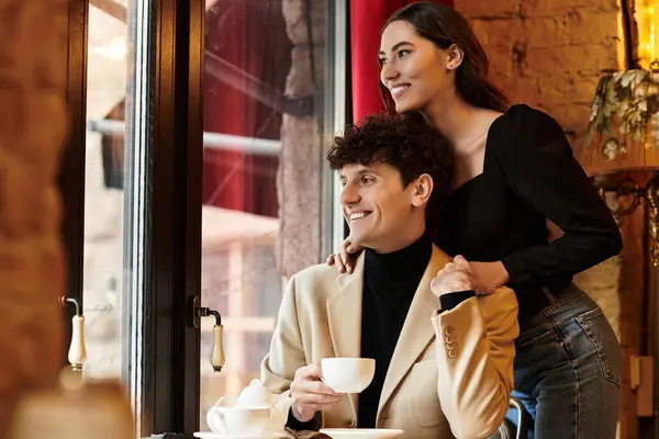 A young couple shares joyful moments together while celebrating their love on Valentines day. — Stock Photo