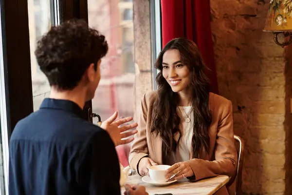 A young couple shares smiles and warmth while enjoying their Valentines celebration together. — Stock Photo