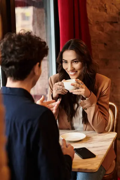 The couple shares joyful moments over coffee, celebrating their love and connection. — Stock Photo