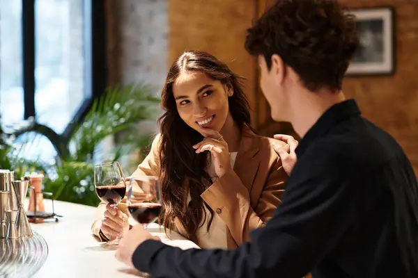 Couple enjoys each other's company while toasting with wine on Valentines Day evening. — Stock Photo