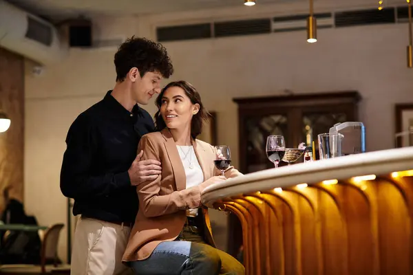 Loving couple shares a special moment while celebrating Valentines Day at a restaurant. — Stock Photo