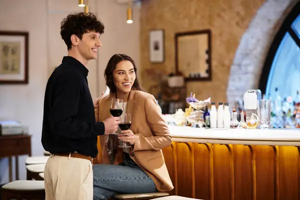 A young couple enjoys joy and intimacy on a special Valentines dinner at a cozy restaurant. — Stock Photo