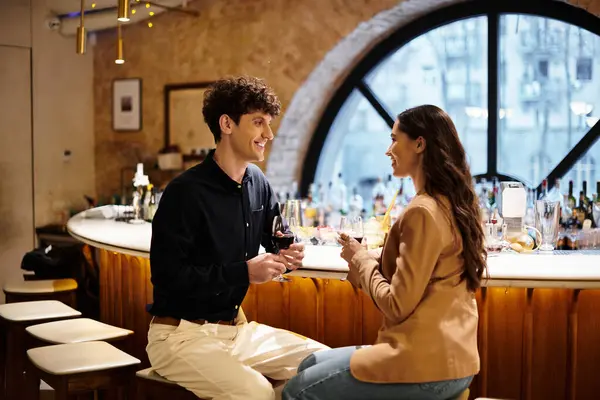 A young couple enjoys a romantic moment together in a chic restaurant. — Stock Photo