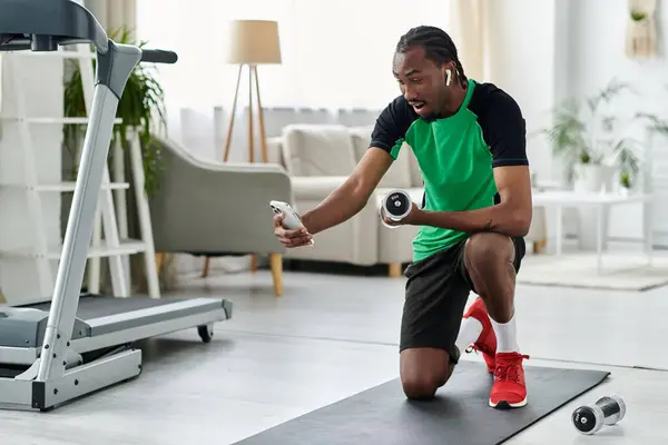 A young man works out at home, combining fitness with his digital nomad lifestyle simultaneously. — Stock Photo
