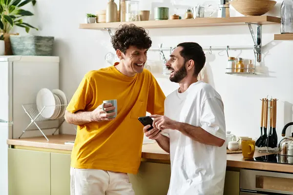Two men sharing laughter and warmth while enjoying each others company at home. — Stock Photo