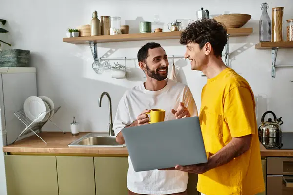 Two men share laughter and warmth while enjoying a cozy afternoon at home. — Stock Photo