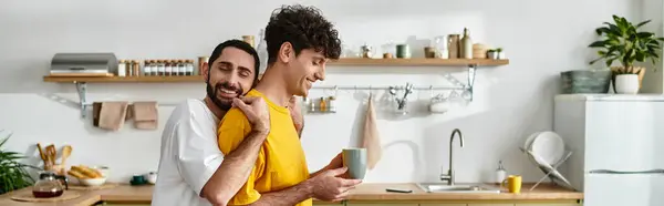 Two happy men embrace in their cozy apartment, enjoying each others company and love, banner — Stock Photo