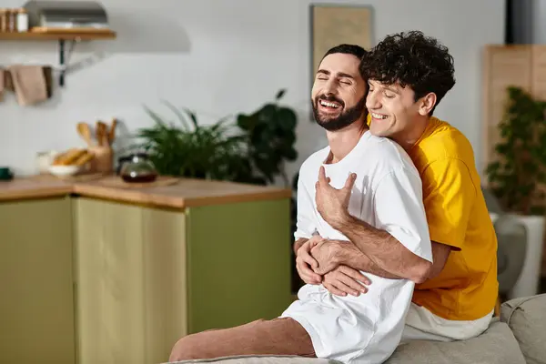 Loving couple embraces in their stylish apartment, celebrating their bond and happiness. — Stock Photo