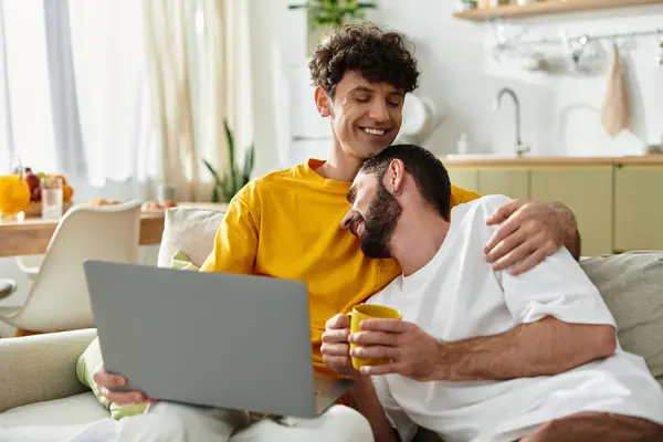 Two men embrace warmly in a stylish apartment while sharing smiles and laughter together. — Stock Photo