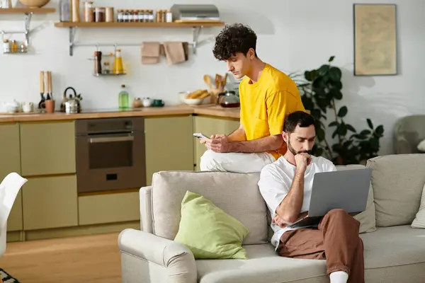 Two men share a cozy moment in their modern apartment, love and joy evident as they connect. — Stock Photo