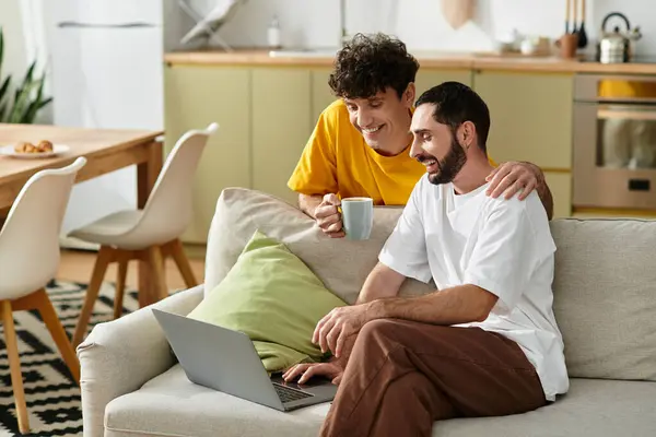 Two men share a joyful moment together while enjoying their cozy home. — Stock Photo