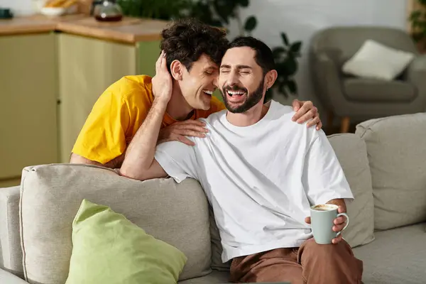 Two men express their love and happiness while enjoying a cozy moment at home. — Stock Photo