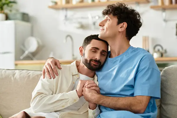 Two men express their love while enjoying a relaxed moment together at home. — Stock Photo