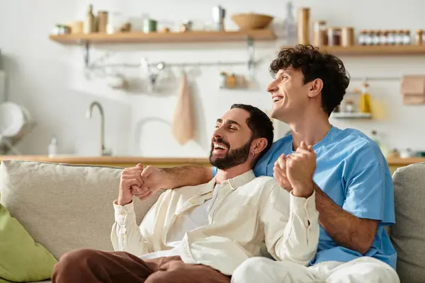 Two men share laughter and warmth while enjoying each others company at home. — Stock Photo