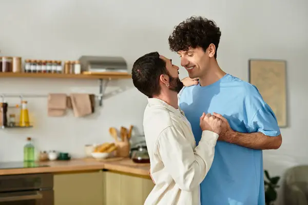Two men embrace in joy, celebrating love in their cozy modern apartment together. — Stock Photo