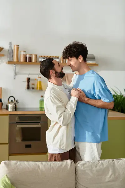 Two men embraced in love, enjoying a cozy afternoon together in their stylish apartment. — Stock Photo