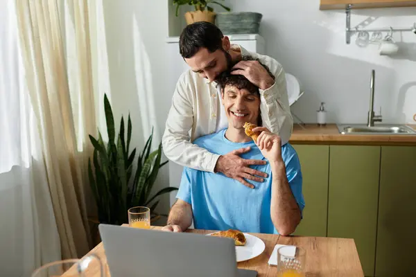 Two men share a beautiful morning breakfast at home, enjoying each others company and joy. — Stock Photo