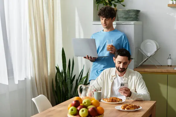 Two men share a joyful breakfast, basking in love and connection at home. — Stock Photo