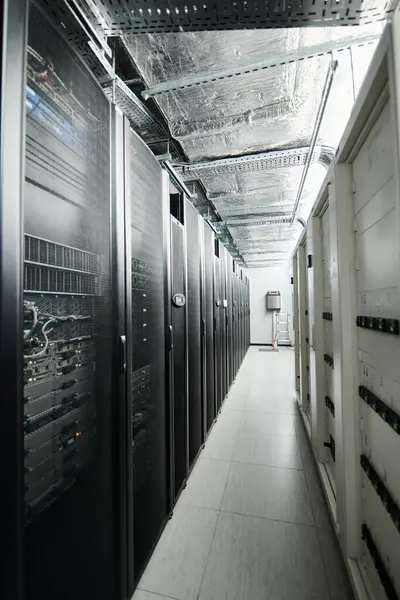 Rows of server towers and advanced systems create a secure data center environment. — Stock Photo