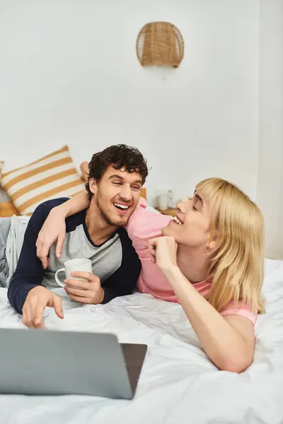 Two men share laughter and affection while enjoying a cozy afternoon together at home. — Stock Photo