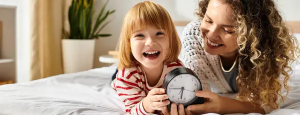 A curly-haired mother and her daughter enjoy playful moments in their cozy living space, banner — Stock Photo