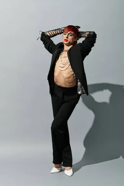A stylish young man poses confidently, showcasing his bold fashion and charisma. — Stock Photo