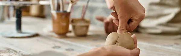 Person enjoys quality time as molding clay during a pottery class, banner — Stock Photo
