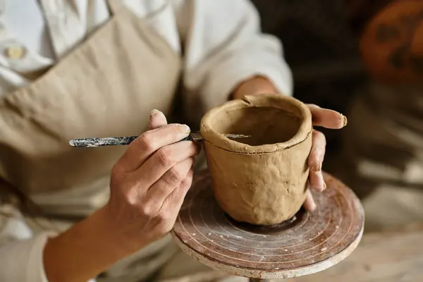 Cropped woman enjoys shaping clay during a pottery class, creating lasting memories. — Stock Photo