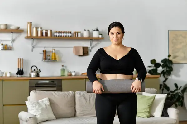 A confident plus sized woman is poised to embrace her yoga practice in a stylish kitchen. — Stock Photo