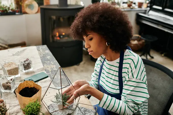 Woman find joy in crafting succulent arrangements in a cheerful workshop. — Stock Photo