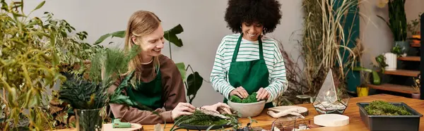 Two friends joyfully crafting succulent arrangements in a vibrant plant workshop setting. — Stock Photo