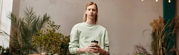 Young handsome man in stylish attire in workshop studio. — Stock Photo