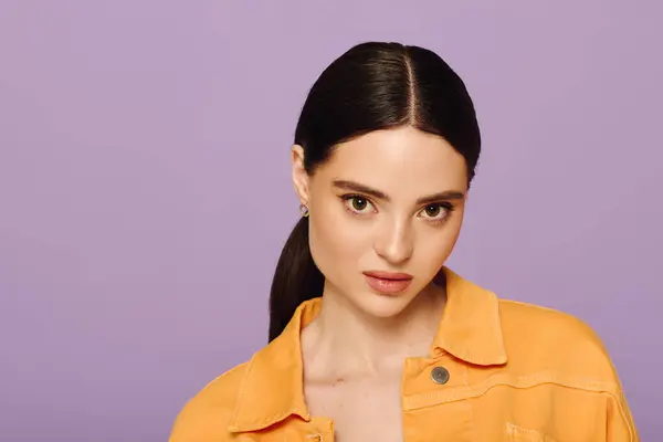 Young woman showcases her unique style against a lively purple backdrop, exuding confidence. — Stock Photo