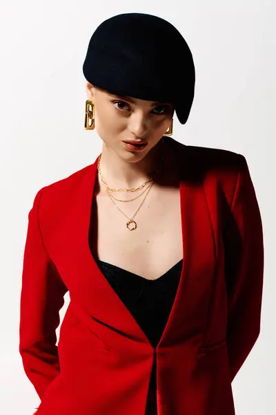 Young woman with an elegant look stands confidently, showcasing her stylish attire and accessories. — Stock Photo