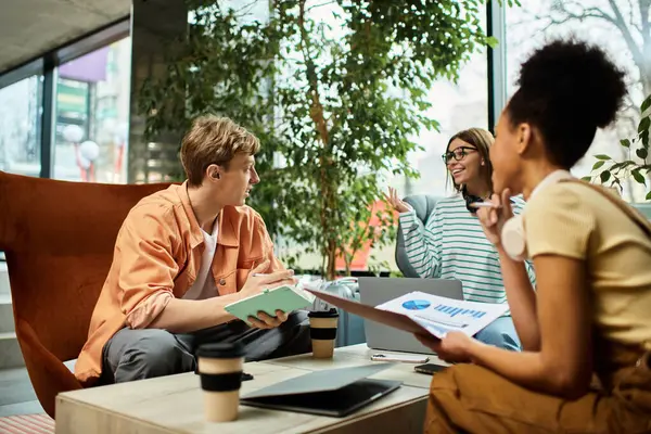 Three colleagues share ideas and strategies while relaxing in a hotel cafe on a business trip — Stock Photo