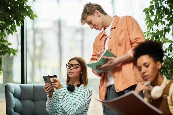 A group of colleagues engages in collaborative tasks in a hotel lounge, sparking creativity. — Stock Photo
