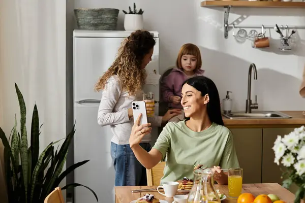 Two loving mothers share a lighthearted moment with their daughter in a stylish apartment. — Stock Photo