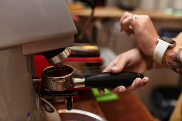 A young woman skillfully brews a perfect cup of coffee in a busy cafe. — Stock Photo