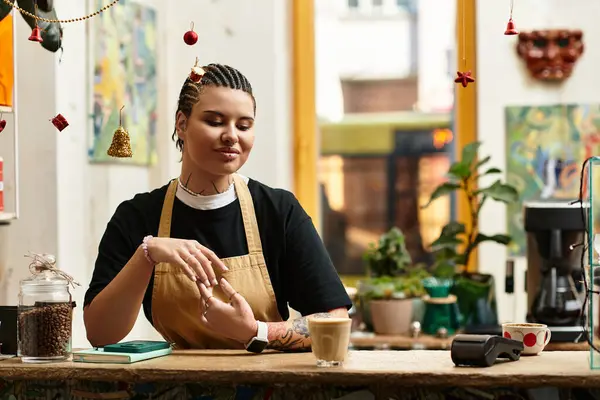 Bright and inviting atmosphere as the young woman savors the cafe vibe while preparing drinks. — Stock Photo